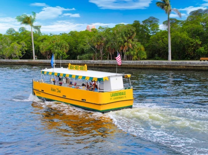A yellow boat with the name 